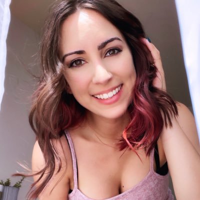 EmmaLayne (@EmmaLayne). Emma is twitch sensation wearing pink top showing big tits.